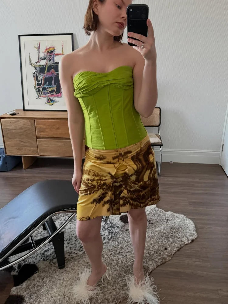 Green bandeau top in a fitted design, perfect for summer outings