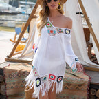 White crochet cover up for the beach with colorful floral accents