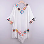 Women's white crochet cover up for the beach, with colorful floral accents
