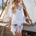 White crochet cover up for the beach with colorful floral accents