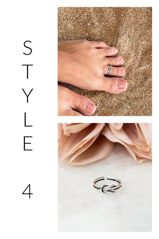 Aili's Corner Women's Ring in Silver, perfect beach jewelry for vacation, worn on a sandy beach