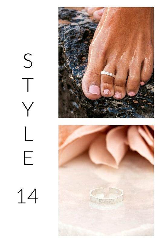 Stylish hexagon ring in silver, perfect beach jewelry for vacation, shown on a toe and a soft surface