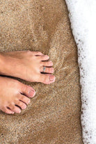 Delicate toe ring for women on sandy beach, perfect beach jewelry for vacation