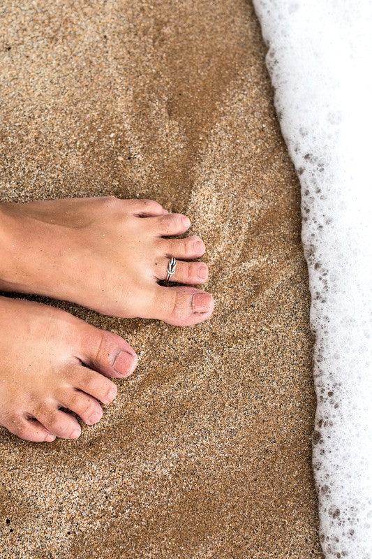 Delicate toe ring for women on sandy beach, perfect beach jewelry for vacation