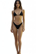 Person wearing a black bikini on a white background