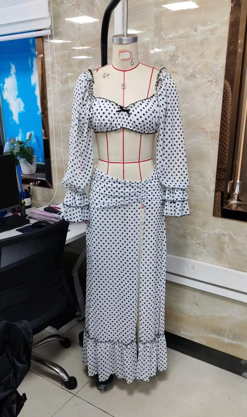 White polka dot beachwear bathing suits with flared sleeves and slit skirt