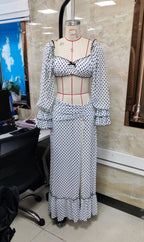 White polka dot beachwear bathing suits with flared sleeves and slit skirt