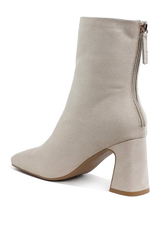 Beige square toe heeled booties by Rag Company with a stylish design and zipper closure