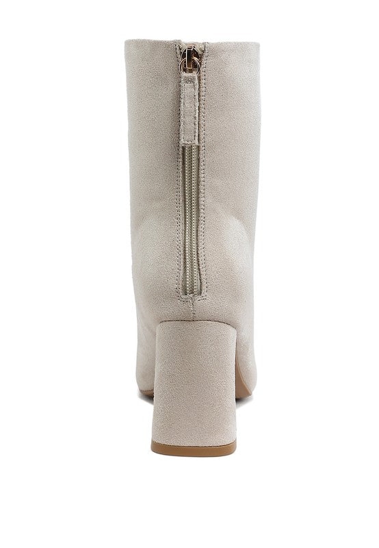 Beige square toe heeled booties with a stylish back zipper for easy wear