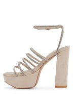 Women's black strappy platform sandals with shimmering details for evening wear