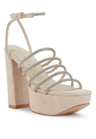 Women's black strappy platform sandals with sparkling details, perfect for parties