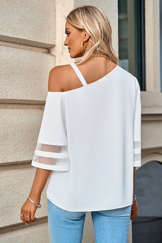 Women's white shirt with bell sleeve design, perfect for casual outings