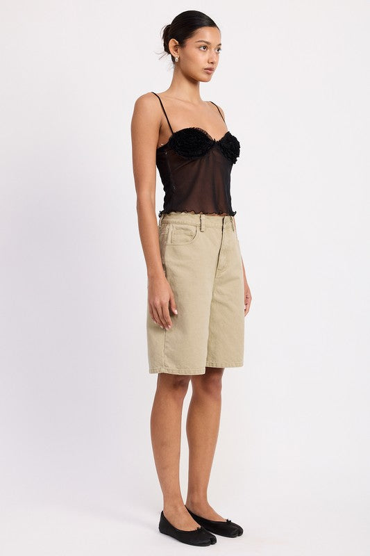 Emory Park sheer mesh floral cami top in black on model with spaghetti straps paired with beige bermuda shorts