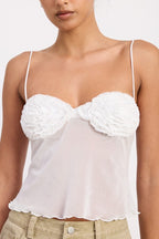 Emory Park sheer mesh floral cami top in white with textured floral cups spaghetti straps and scalloped hem on model