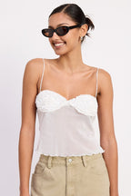 Emory Park sheer mesh floral cami top on smiling model with white floral cups thin straps scalloped hem and khaki pants