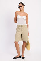 Model wearing Emory Park sheer mesh floral cami top with beige long shorts black flats and yellow tote