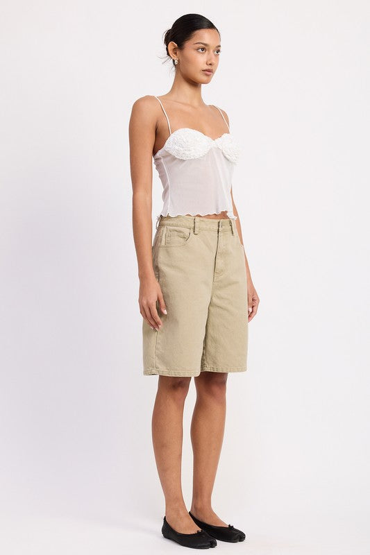 Model wearing Emory Park sheer mesh floral cami top in white with khaki knee length shorts and black flats