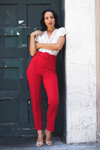 Red women's pants with a belt with a buckle, chic style for outings
