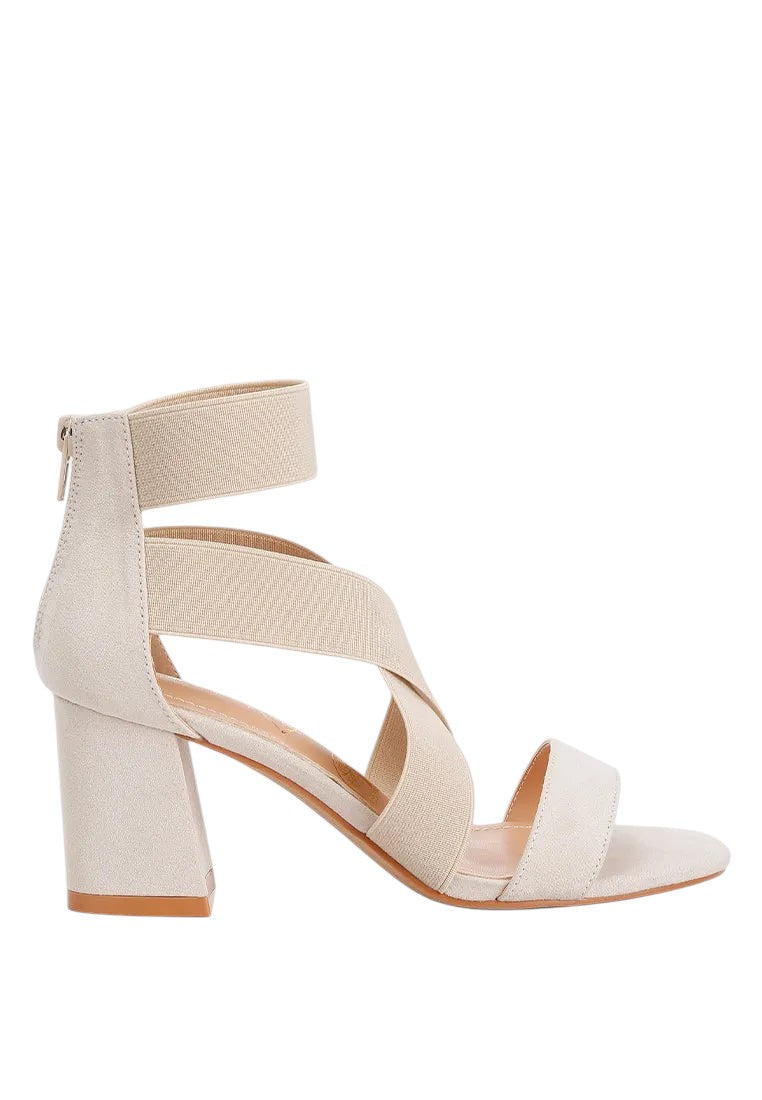 Beige sandal with block heel on a white background