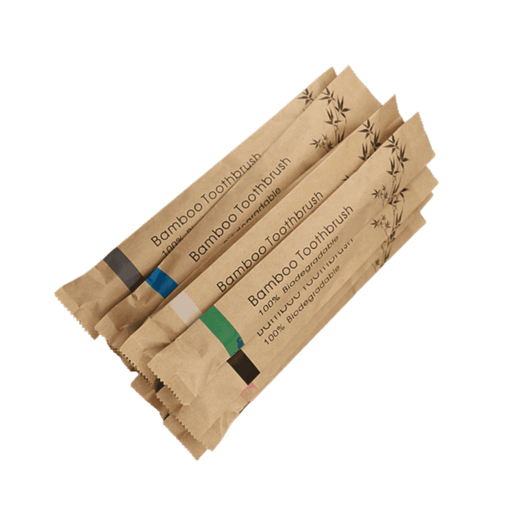 Pack of biodegradable bamboo toothbrushes in eco-friendly packaging for sustainable travel essentials