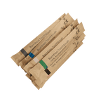 Pack of biodegradable bamboo toothbrushes in eco-friendly packaging for sustainable travel essentials