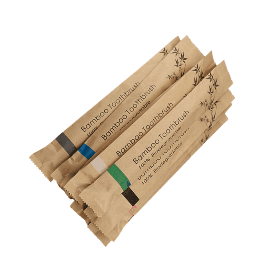 Pack of biodegradable bamboo toothbrushes in eco-friendly packaging for sustainable travel essentials