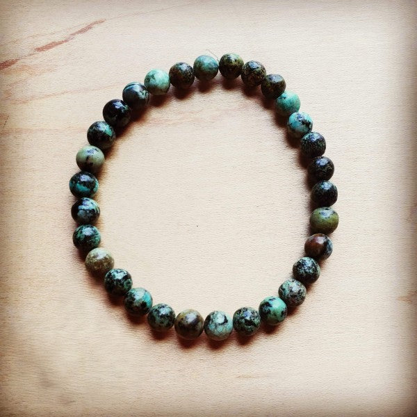Black African turquoise bead bracelet with natural hues of green and brown for stylish accessorizing