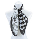 Bella Chic black and white silk scarf with artistic patterns perfect for stylish accessorizing