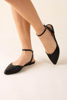 Fortune Dynamic black ankle strap flats designed for stylish comfort and flexibility.