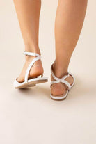 Fortune Dynamic black ankle strap flats with a stylish design for comfortable summer wear