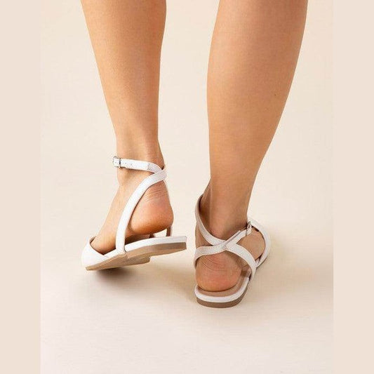Fortune Dynamic black ankle strap flats with a stylish design for comfortable summer wear