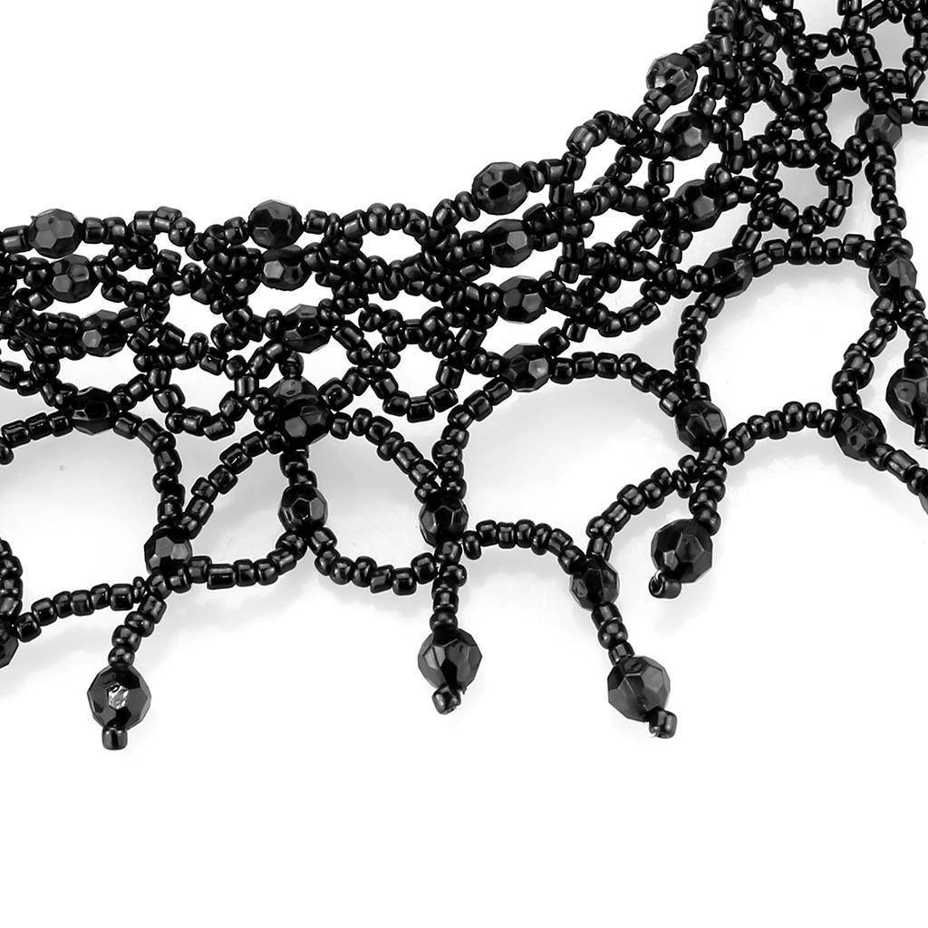 Elegant black beaded choker necklace with intricate design and glossy beads for a chic look
