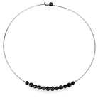 Black beaded minimalist necklace on a silver wire, featuring sleek black beads aligned gracefully