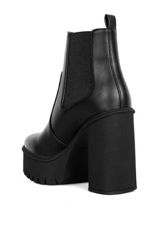 Stylish black block heel ankle boots in smooth material with a trendy design and durable sole