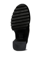 Sole of black block heel ankle boots by Rag Company, featuring a textured grip for comfort and stability