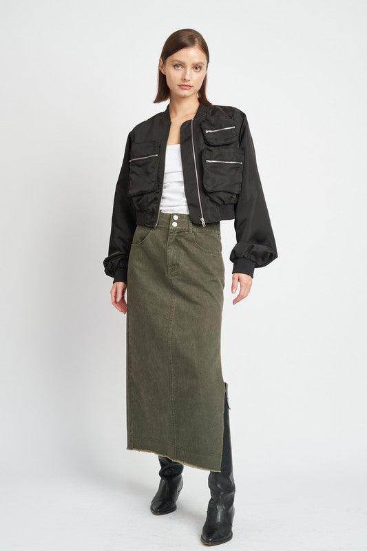 Fashionable black brown bomber jacket with oversized pockets styled with a long skirt