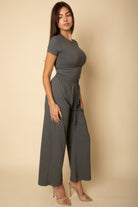 VacationGrabs women's black casual travel outfit featuring a fitted top and wide-leg pants
