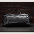 Stylish black coffee leather duffel bag with sturdy handles and spacious interior