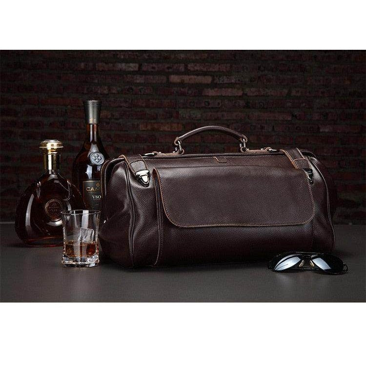 Stylish black coffee leather duffel bag with sleek design, perfect for travel or gym use