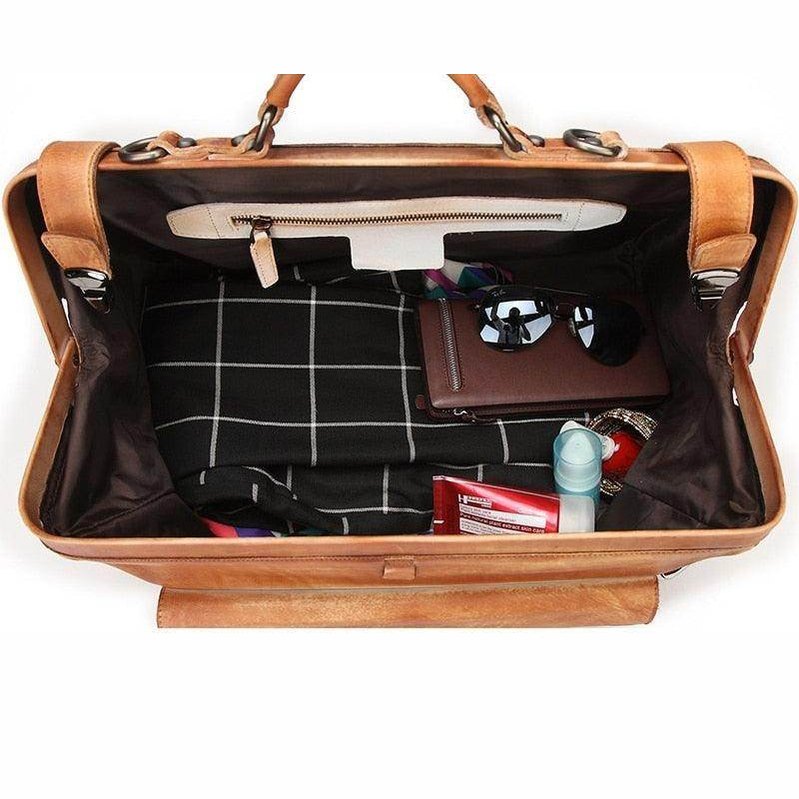 Interior view of black coffee leather duffel showing organized compartments and accessories