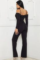 Stylish black cutout jumpsuit for women with off-shoulder design and fitted silhouette