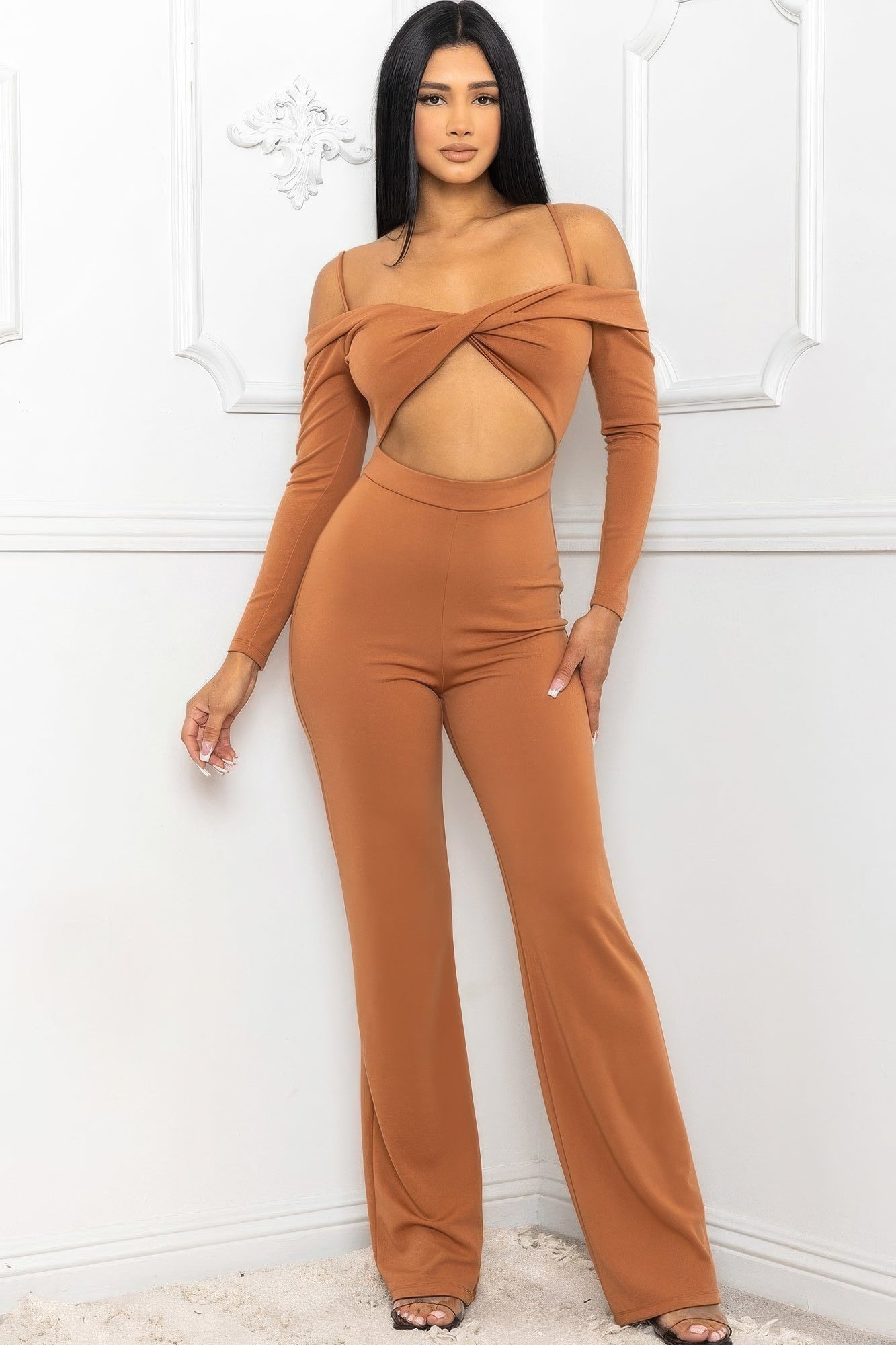 Stylish women's jumpsuit in brown with cutout details, perfect for fashion-forward looks