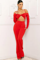 Stylish red jumpsuit for women featuring a trendy cutout design and off-shoulder sleeves