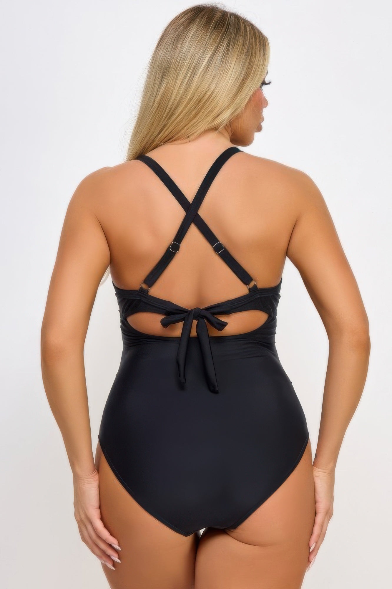 Black women's swimsuit with back cutout design and adjustable straps, perfect for beach wear