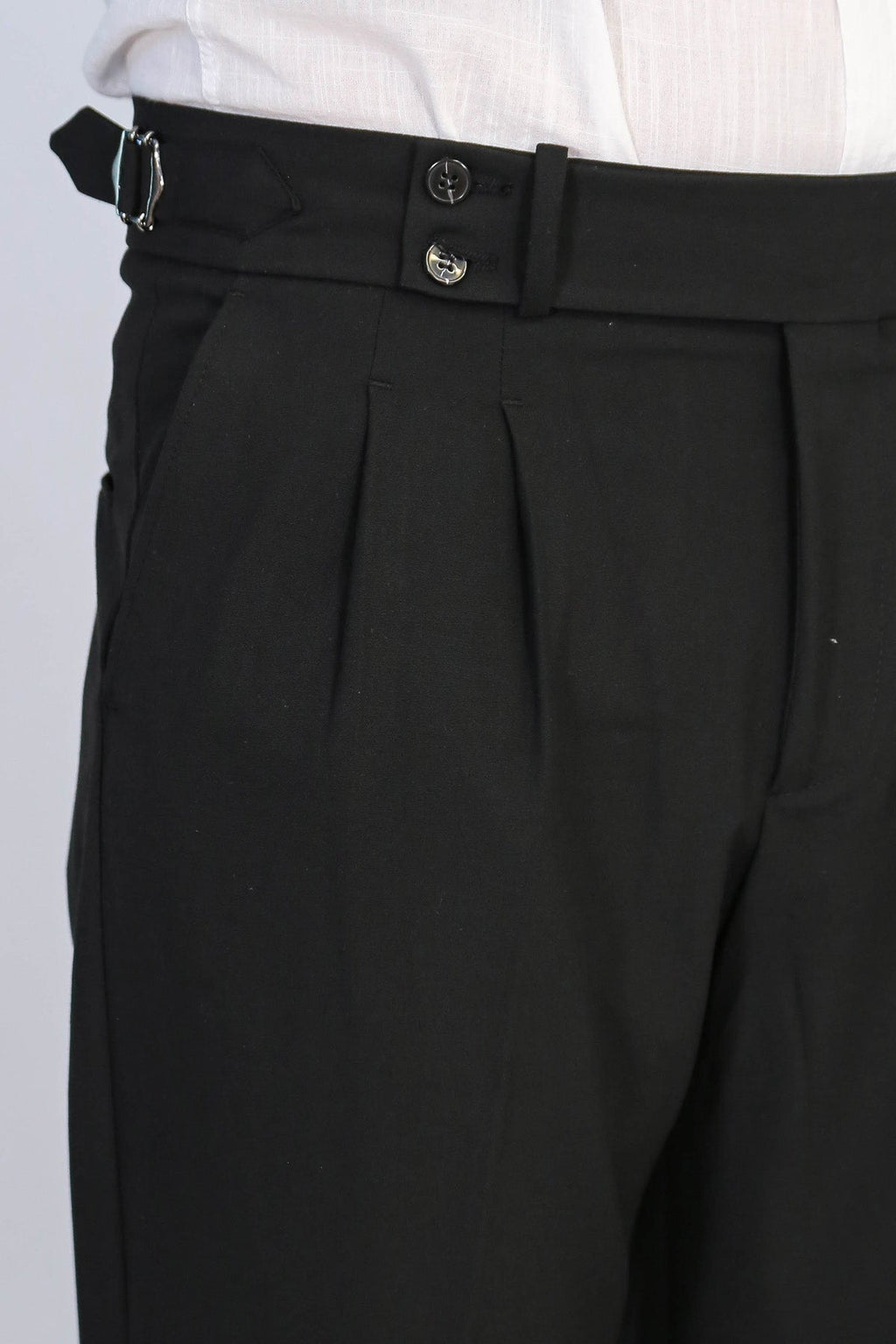 Black Double-Pleated High-Waisted Slim Fit Trousers with Side Buckles – detail view