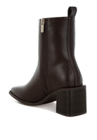 Stylish black faux leather ankle boots with a chunky heel and zipper detail from Rag Company