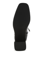 Sole view of Rag Company black faux leather ankle boots with a stylish design and sturdy grip