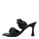 Elegant black heeled summer sandals with stylish crisscross design for chic summer outfits
