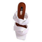 Stylish white heeled summer sandals with a unique wrap design for a modern look