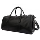 Spacious black leather weekend bag with sturdy handles and adjustable shoulder strap for travel convenience